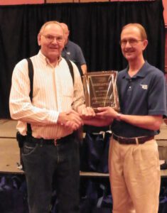 Bill Tucker, Kingfisher City Clerk receiving the Marvin Hicks-Al Middleton Meritorious Service Award from  MESO Board President Dean Sherrick 